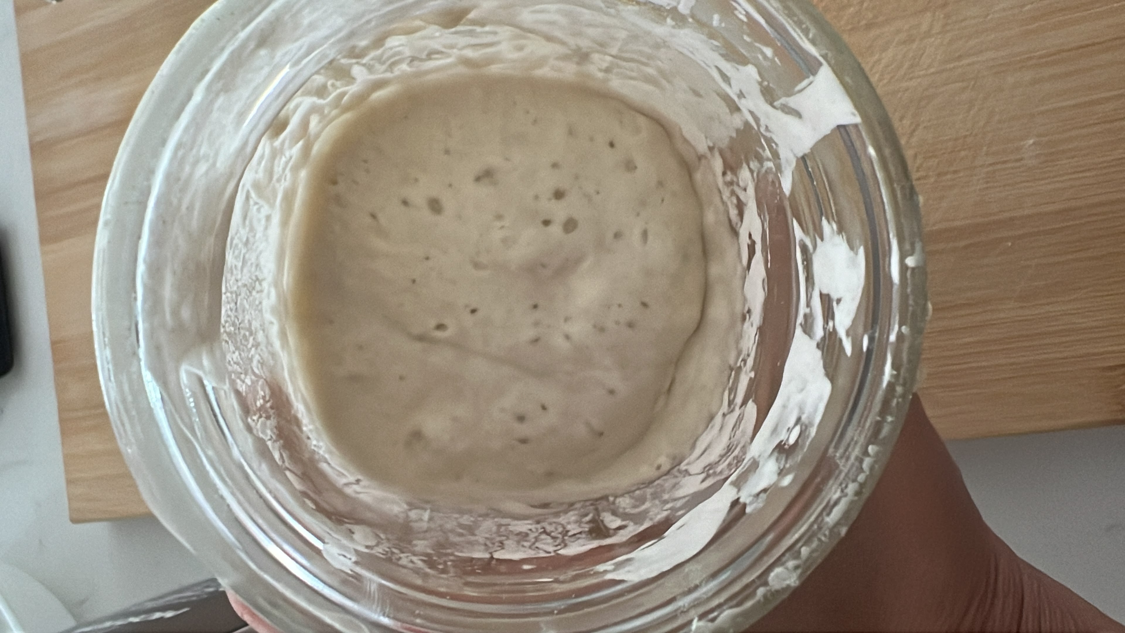 Jar with starter dough after doubling in size